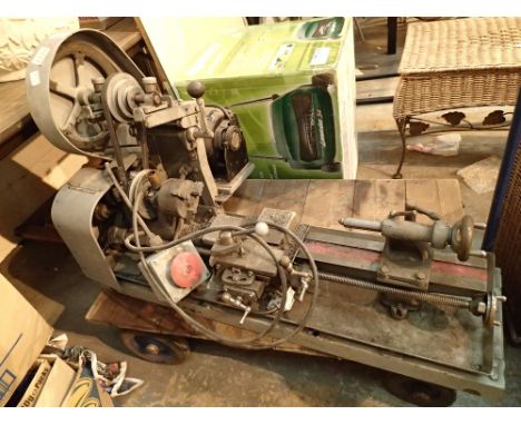 Pools Special L169 230V lathe with additional tools and parts behind counter 