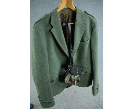 A medium-large men's green woollen tweed Scottish cutaway jacket and deer fur sporran containg a silver plated sporran flask.