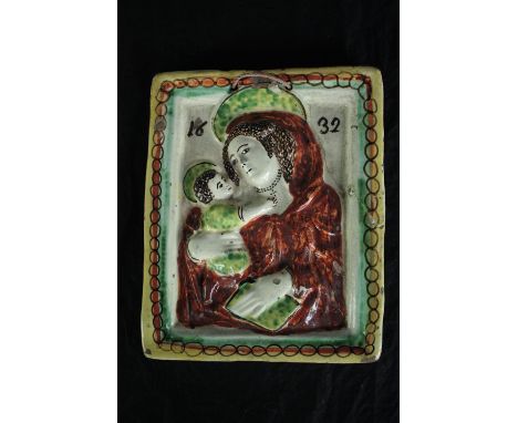 A ceramic Madonna and child icon. Dated 1832. H.34 W.34cm. 