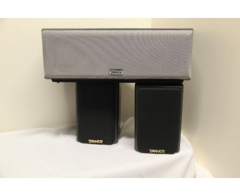 A pair of Tannoy Speakers with stands m/R B/eye and Sub Woofer MXC