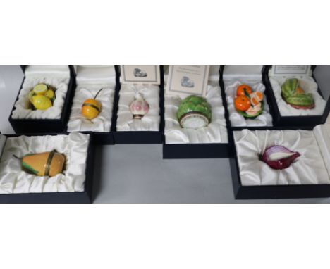 Eight Halcyon Days enamel bonbonierres modelled as fruit and vegetables; pear, red onion, apple, basket of tangerines, cantel