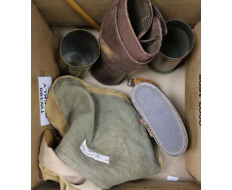 A British WWI collar box, a haversack and gaiters, two WW1 shell cases and a swagger stick