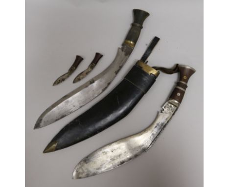 A kukri and scabbard, and another without scabbard, 42cm