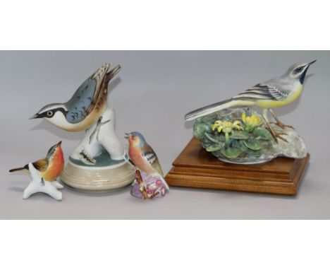 A Royal Worcester model of a grey wagtail, and three other bird figures
