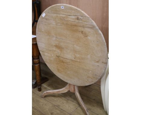 An early 19th century pine tripod table, W.92cm