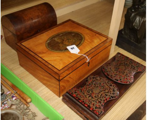 A Regency satinwood work box, a red boullework bookrack and a burr walnut tea caddy