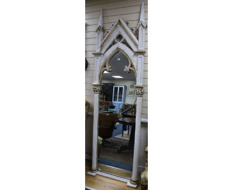 A parcel gilt painted pine gothic wall mirror H.250cm. W.79cm.