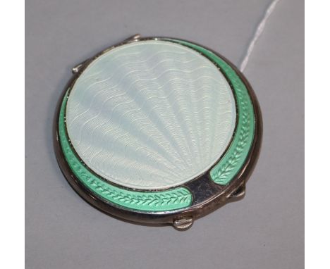 A 1940's Art Deco silver and enamel circular compact, 67mm.