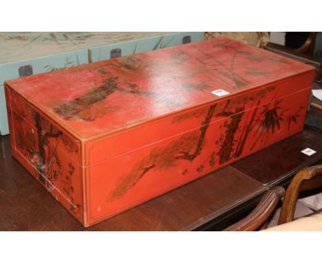 A Chinese red lacquer trunk with gilt bamboo decoration
