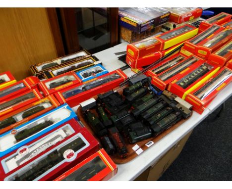 A large collection of 00 gauge railway items, mainly by Hornby and including boxed sets of 'Harry Potter Hogwarts Express', '