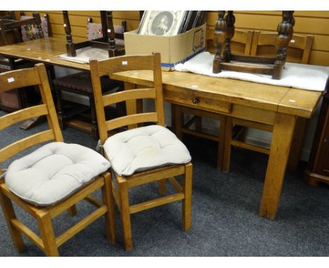 A twentieth century farmhouse table with centre drawer, 126cms long together with four ladder back chairs Condition reports p