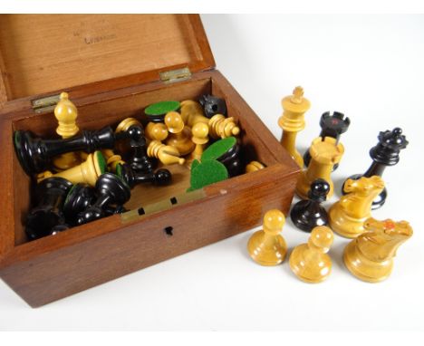 A vintage wooden boxed set of carved chess pieces inscription to the box 'R Whitty, Liverpool' (purchasers must check complet