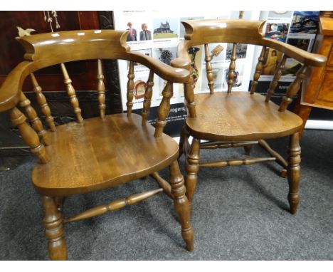 A pair of reproduction oak smoker's bow chairs Condition reports provided on request by email for this auction otherwise item