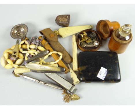 An interesting parcel of collectables including ivory cigar cutter in the form of a champagne bottle, collection of gents stu