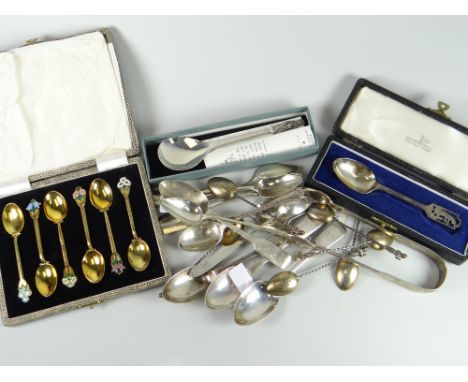A parcel of silver spoons including a cased set of six silver gilt spoons with floral enamel handles, a cased Walker &amp; Ha