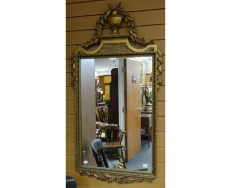 Twentieth century gilt framed rectangular wall mirror having urn and foliate decorated pediment, 121cms high Condition report