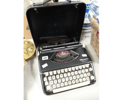 A retro Olympia Splendid 66 cased typewriter Condition reports provided on request by email for this auction otherwise items 