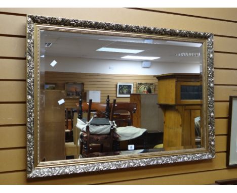 A modern gilt framed bevelled wall mirror Condition reports provided on request by email for this auction otherwise items pur