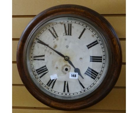 An Ansonia American circular dial station-office type wall clock in oak surround and bearing Roman numerals Condition reports