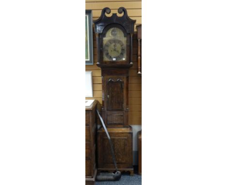 A nineteenth century oak encased brass dial 8-day longcase clock having silvered chapter dial bearing Roman numerals and conc