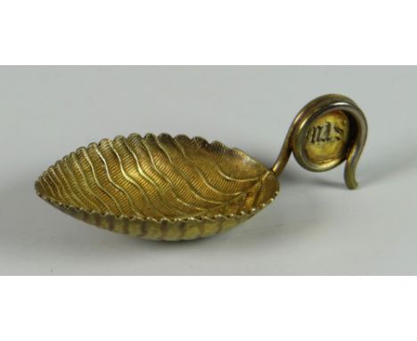 A Georgian silver caddy spoon in the form of a textured leaf with twisting handle bearing engraved monogram, 18grams Conditio
