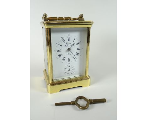 Late twentieth century brass encased carriage clock with rectangular white enamel dial bearing Roman numerals and subsidiary 