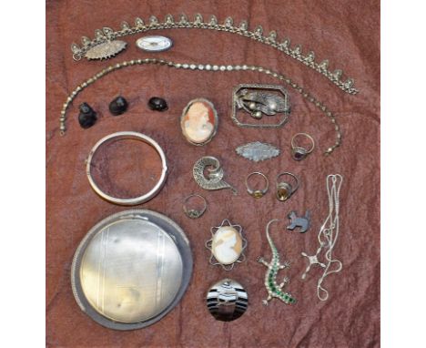 A silver powder compact; a silver bangle; a late 19th century agate brooch; black cat charms; cameo brooch; marcasite brooch;