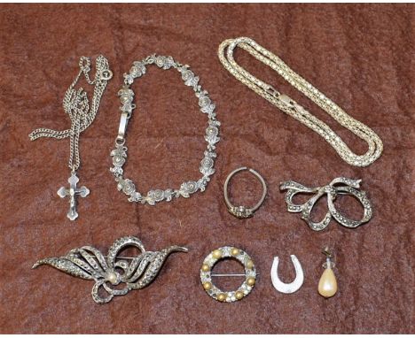 A marcasite bracelet; brooches; a silver chain; a crucifix