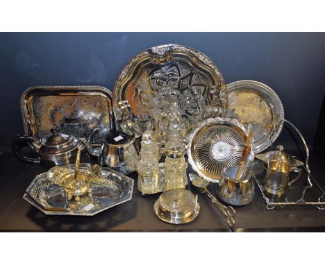 A silver plated cruet set stand with four cut glass bottles; an EPNS three piece tea service; an EPNS serving tray, swing han