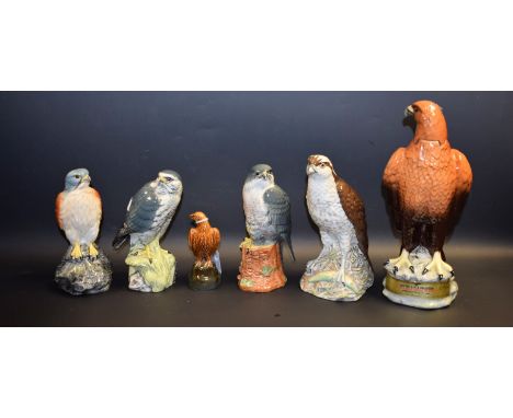 A Beswick Beneagles Scotch Whisky decanter modelled as a Golden Eagle, 26cm high; other whisky bottles, Osprey, Merlin, Pereg