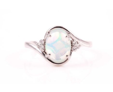 A platinum, diamond, and Welo opal ring, the crossover style mount set with an oval cabochon opal, set with three small round