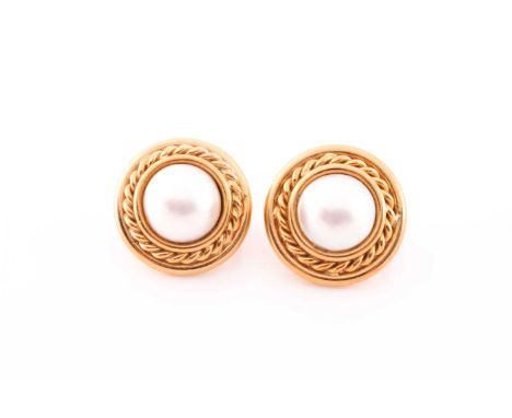 A pair of 18ct yellow gold and Mabe pearl earrings, set with a round white pearl, approximately 11 mm diameter, within a styl