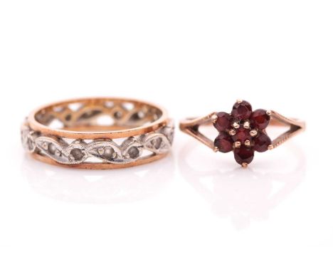 A 9ct yellow gold and garnet floral cluster ring, size L, together with a 9ct yellow gold openwork eternity ring set with whi