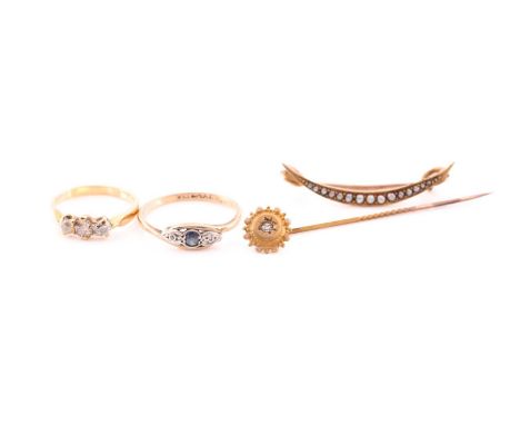 A three stone half hoop diamond ring, an Edwardian sapphire and diamond crossover ring, a small crescent brooch set with seed