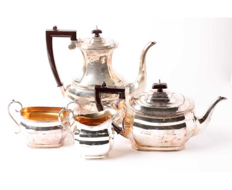 A George VI four-piece silver tea set, London 1948 by 'SL', comprising teapot, hot water pot, (each with a bakelite handle an