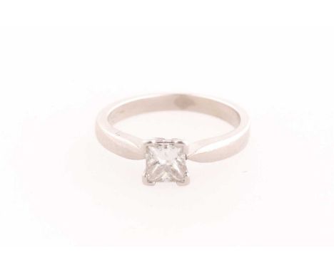 A platinum and diamond ring, set with a square-cut diamond of approximately 0.50 carats, approximate colour / clarity I/J Si2