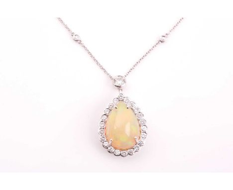 An 18ct white gold, diamond, and opal drop pendant necklace, set with a oval cabochon opal of approximately 10 carats, surrou