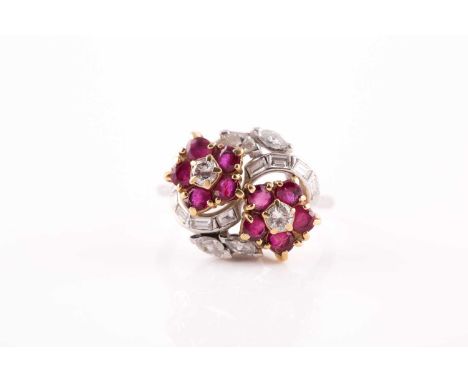 A ruby and diamond floral crossover ring, set with mixed round-cut rubies, the mount set with baguette-cut and marquise-cut d