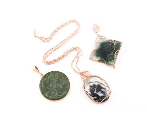 An unusual 14ct yellow gold and moss agate pendant, the squared mount with plain carved facets, the suspension loop marked '5