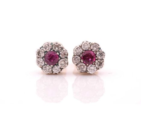 A pair of diamond and ruby floral cluster earrings, the rubies of approximately 0.80 carats combined, total diamond weight ap