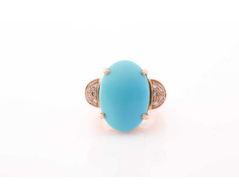 A yellow metal and turquoise dress ring, set with a smooth oval turquoise, measuring approximately 19.6 x 13.7 mm, the should