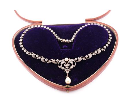 A late Victorian paste and simulated pearl necklace in fitted case, composed of scrolling links and centrepiece with drop pea