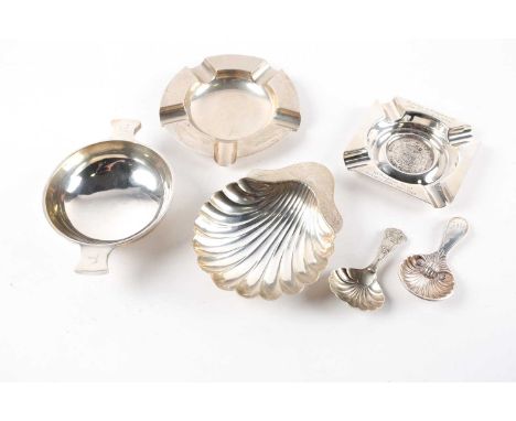 A silver caddy spoon with shell shaped bowl, Sheffield 1910, together with a silver plated example, a silver quaiche, the han