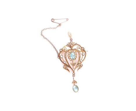 An Edwardian yellow metal, topaz, and split seed pearl pendant, in the Art Nouveau style, set with two oval-cut teal-blue sto