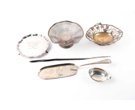 An eighteenth century silver gilt swing-handled basket, London hallmarks (date and maker indistinct). with grape and vine dec
