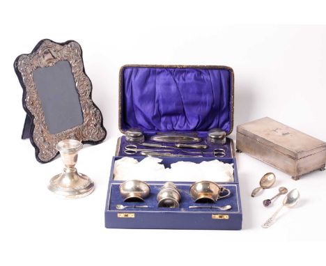 A silver-mounted easel photograph frame, marked '925', aperture size 14 cm x 10 cm, together with a silver cigarette box, can