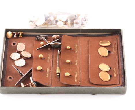 A pair of 9ct rose gold cufflinks, foliate engraved; Birmingham 1912; a leather wallet containing 9ct gold cufflinks and stud