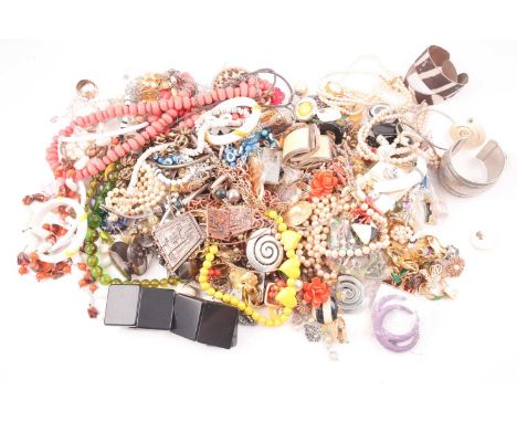 A large bag of various costume jewellery items, to include various beaded necklaces, bracelets, clip and stem earrings, brooc