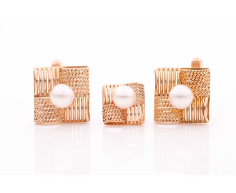 A pair of yellow metal and pearl cufflinks, each set with a cultured pearl, in a squared mount with rope-twist detail, 16 x 1