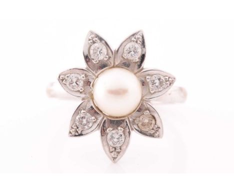 An 18ct white gold, pearl, and diamond floral cluster ring, each petal inset with a round-cut diamond, cluster approximately 